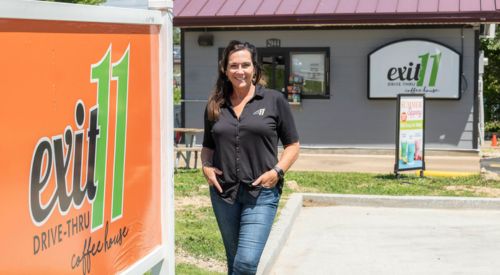 MBA Grad Angela Garland poses at Exit 11 shop